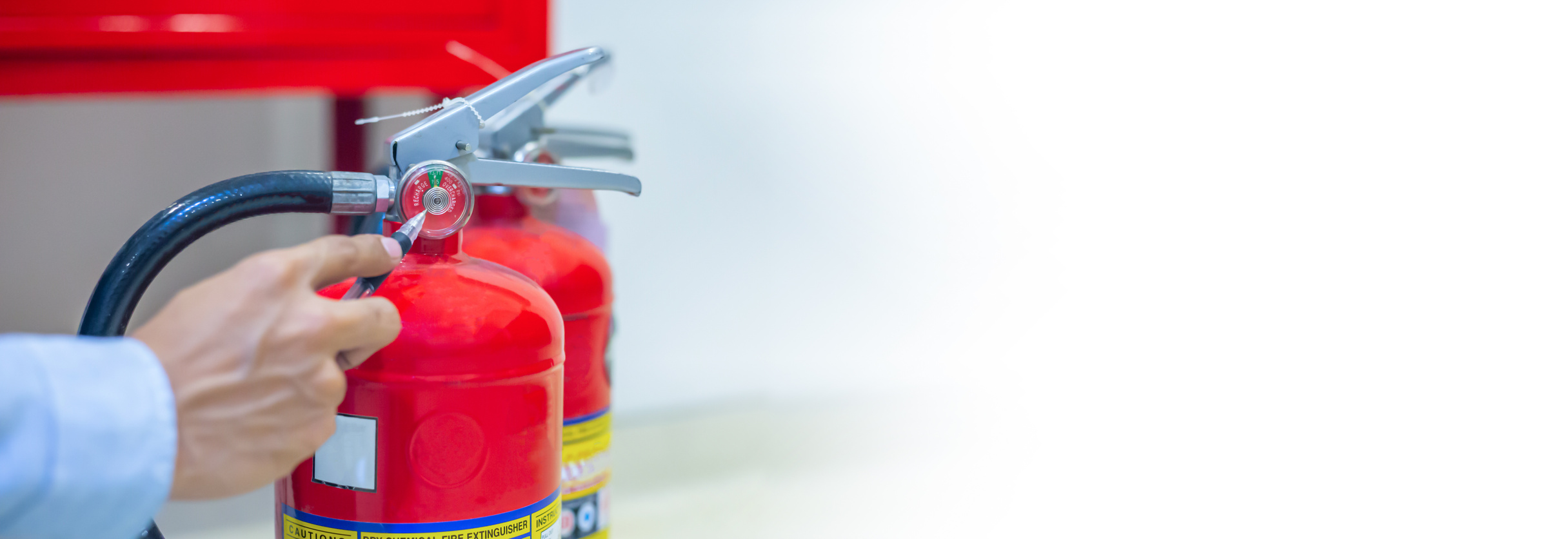 Inspection Fire extinguisher and fire hose,Ready to use in the event of a fire.Safety first concept.